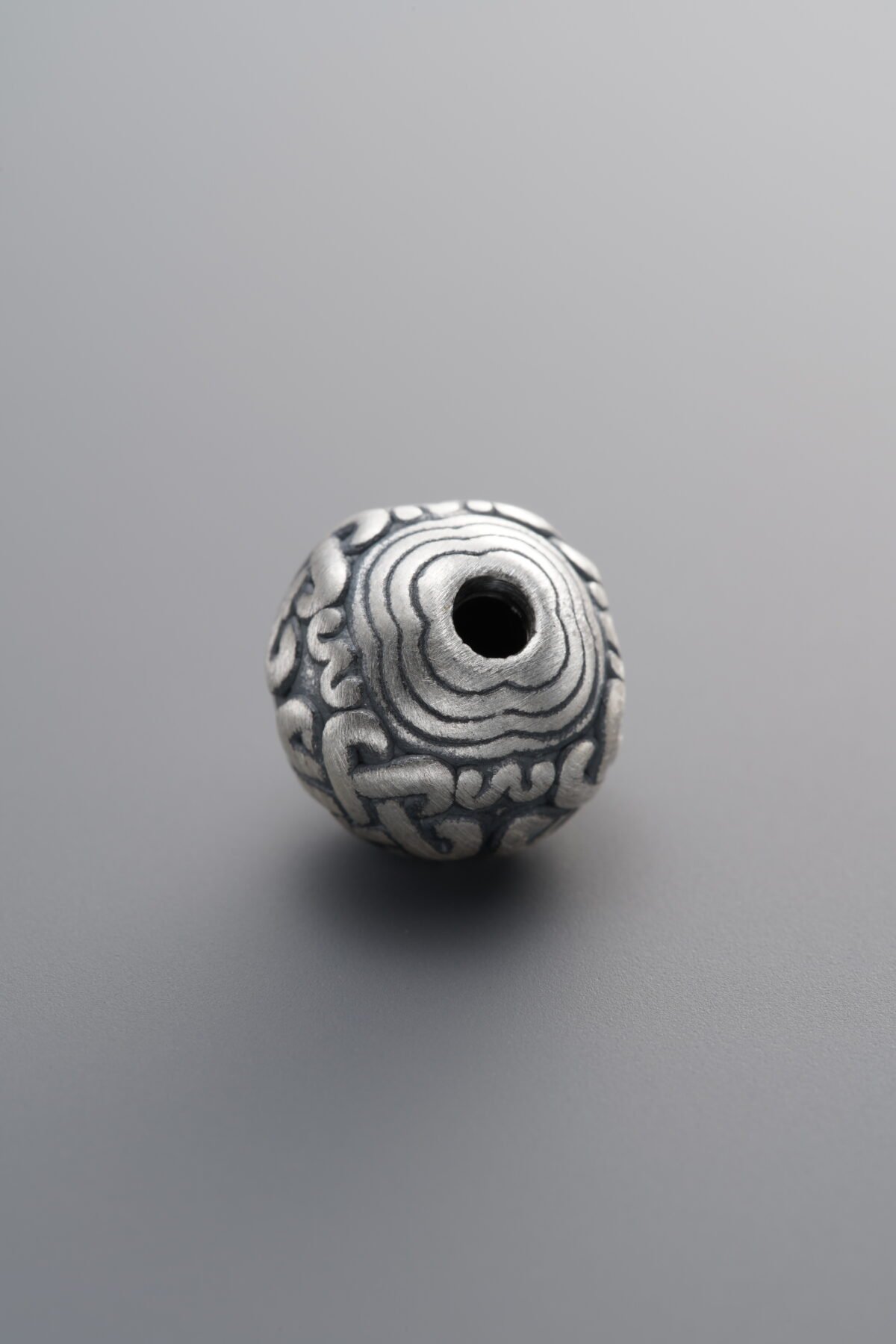 999 Fine Silver-Antiqued-Dimensional Chinese Knot Spacer Bead-10mm - Image 1